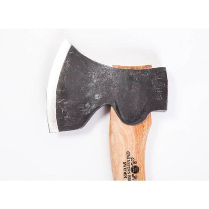 A top-down view of the Gransfors Bruk Swedish Carving Axe - Left Bevel with a wooden handle and a charcoal-colored blade against a white background.