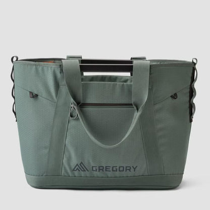 A front view of the Gregory Alpaca Utility Tote 50L in Nomad Green with a zippered pocket and logo visible against a plain background.