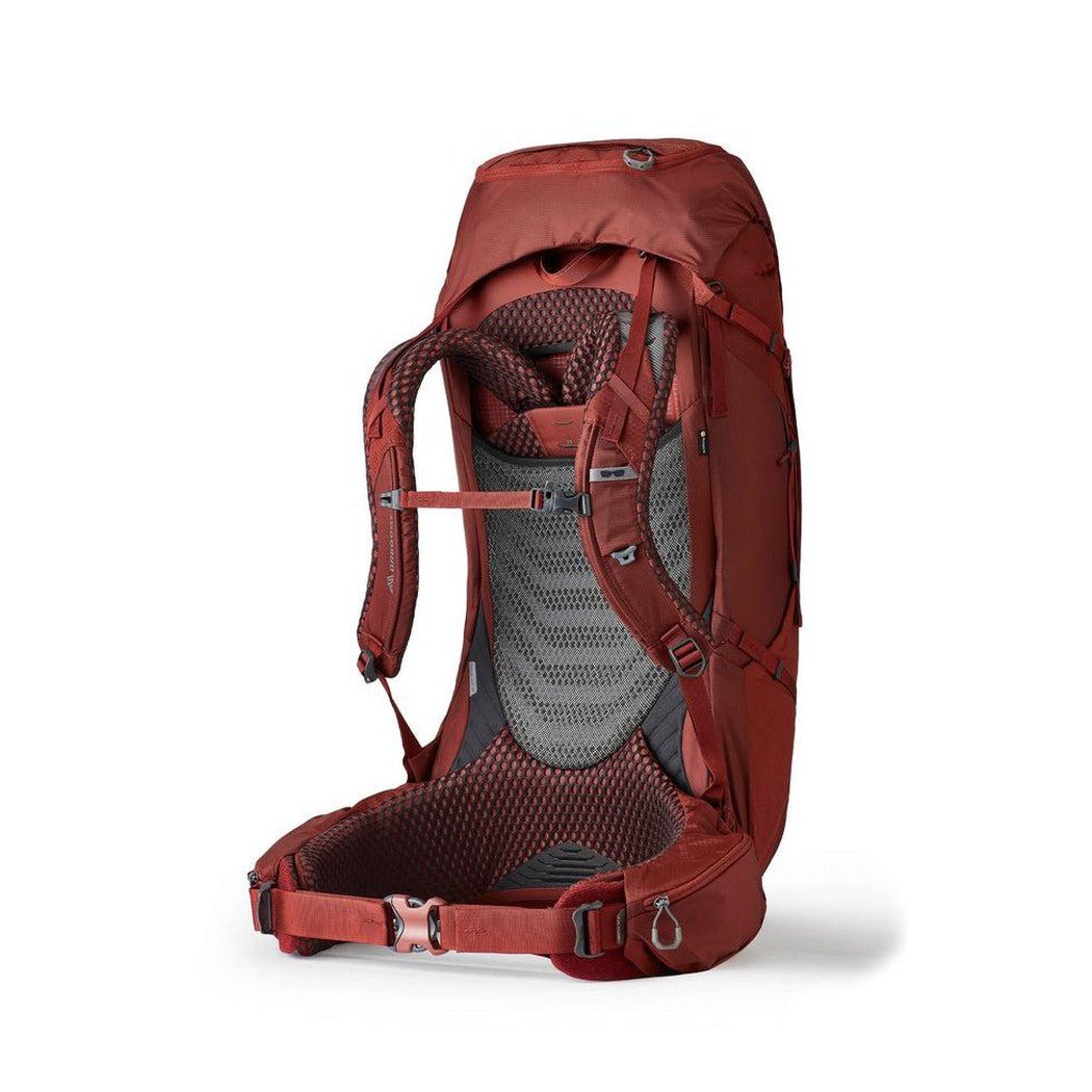 Side view of the Gregory Baltoro 65 in Brick Red showing the padded back panel and hip belt against a white background.