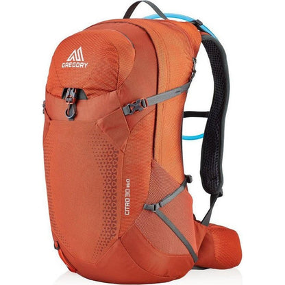 Side view of the Spark Orange Gregory Citro 30 H20 showing the hydration tube and black shoulder straps against a white background.