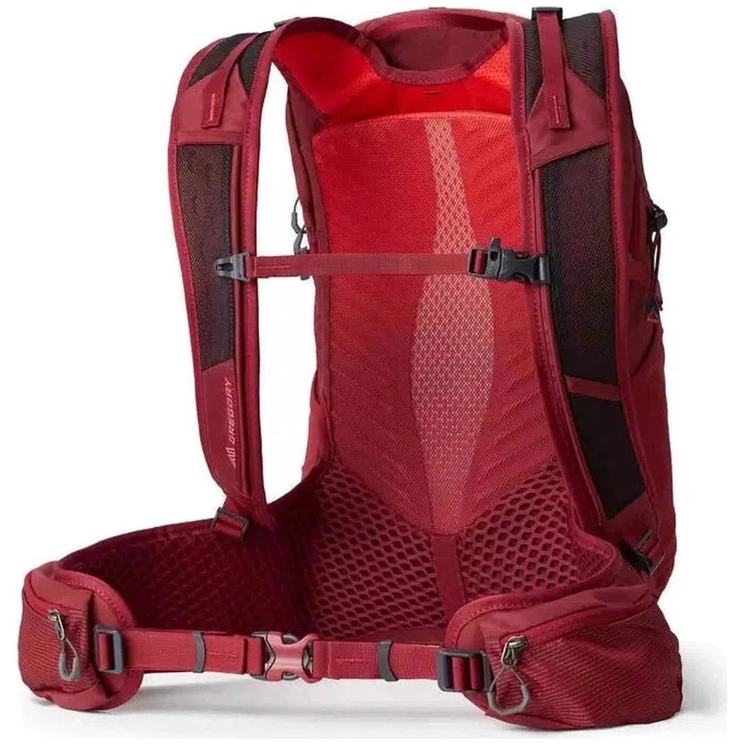 Side view of the Gregory Maya 20 Plus in Iris Red showing the breathable mesh back panel and waist belt against a white background.