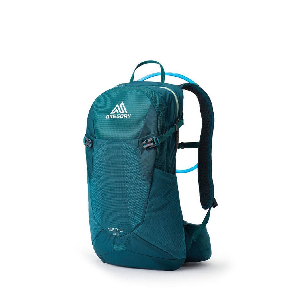 A front view of the Gregory Sula 8 H20 daypack in Antigua Green with a blue hydration tube visible against a white background.