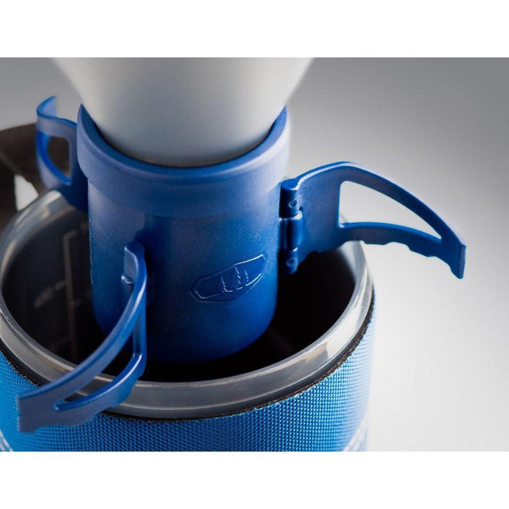 A close-up of the blue GSI Outdoors Coffee Rocket with its handle extended, sitting in a blue pot.