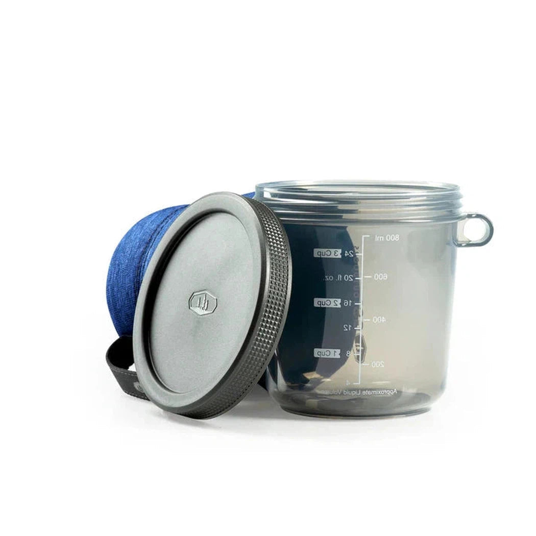 A blue GSI Outdoors Infinity Fairshare Mug with a charcoal lid sits on a white background.