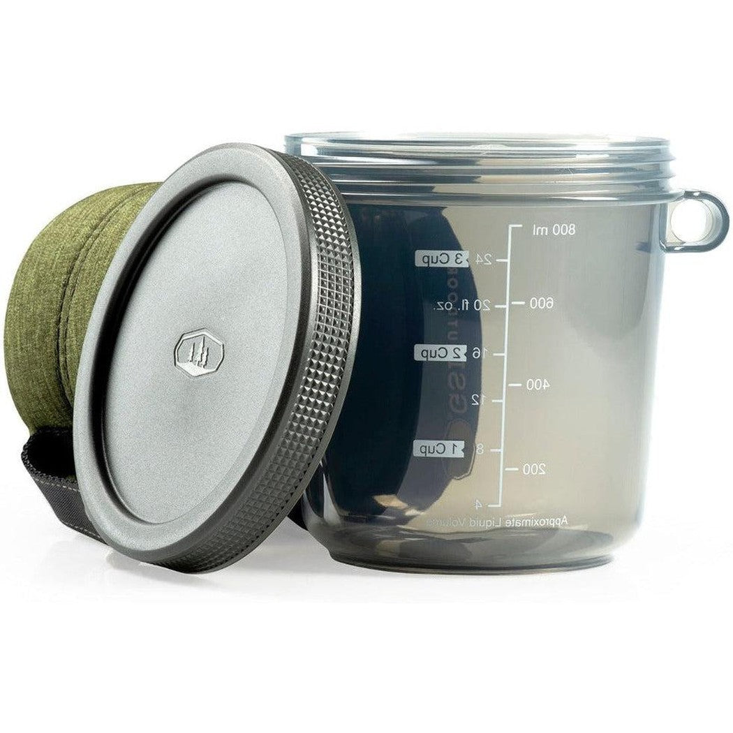 A side view of the GSI Outdoors Infinity Fairshare Mug in Green showing the lid and measurement markings against a white background.