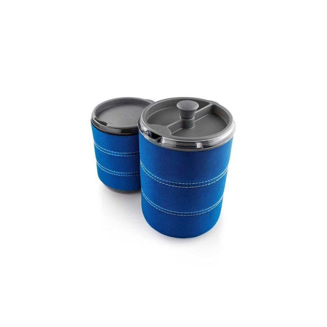 Two blue GSI Outdoors Personal JavaPress camping mugs with charcoal lids on a white background.