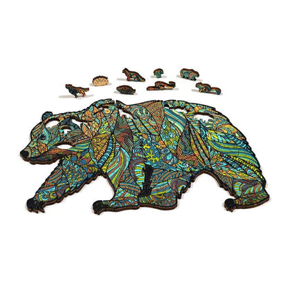 A top-down view of the GSI Outdoors Wood Puzzle Bear showing the colorful, patterned bear design against a white background.