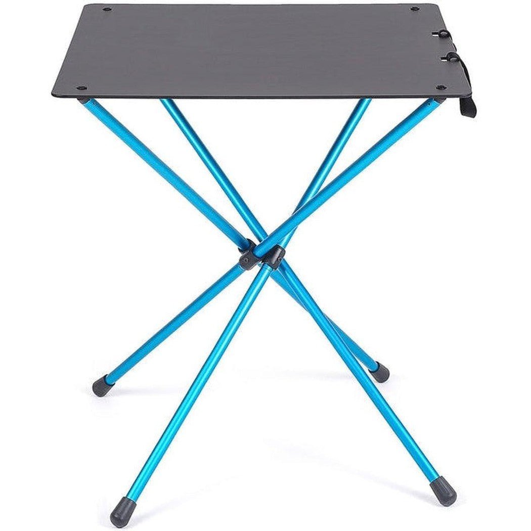 A top-down view of the Helinox Cafe Table in Black with blue legs and a foldable design against a white background.