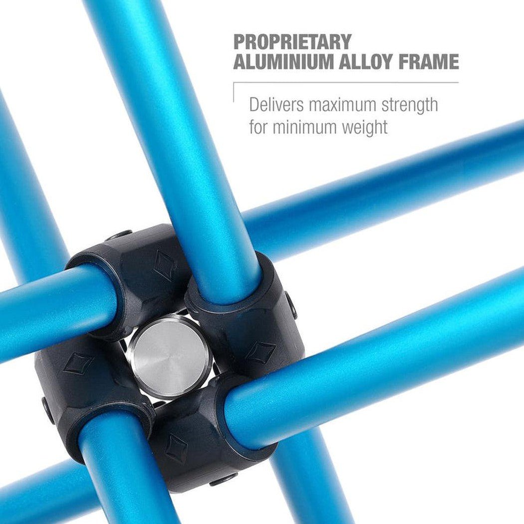 Close-up of the Helinox Cafe Table in Black showing the proprietary aluminum alloy frame joint and white background.