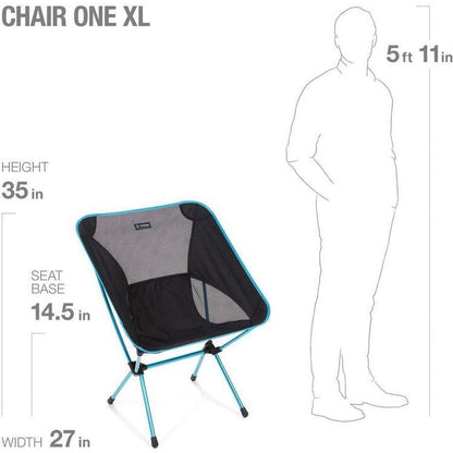 The Helinox Chair One XL in Black is shown from a front angle with its dimensions labeled, standing next to a 5ft 11in tall model.