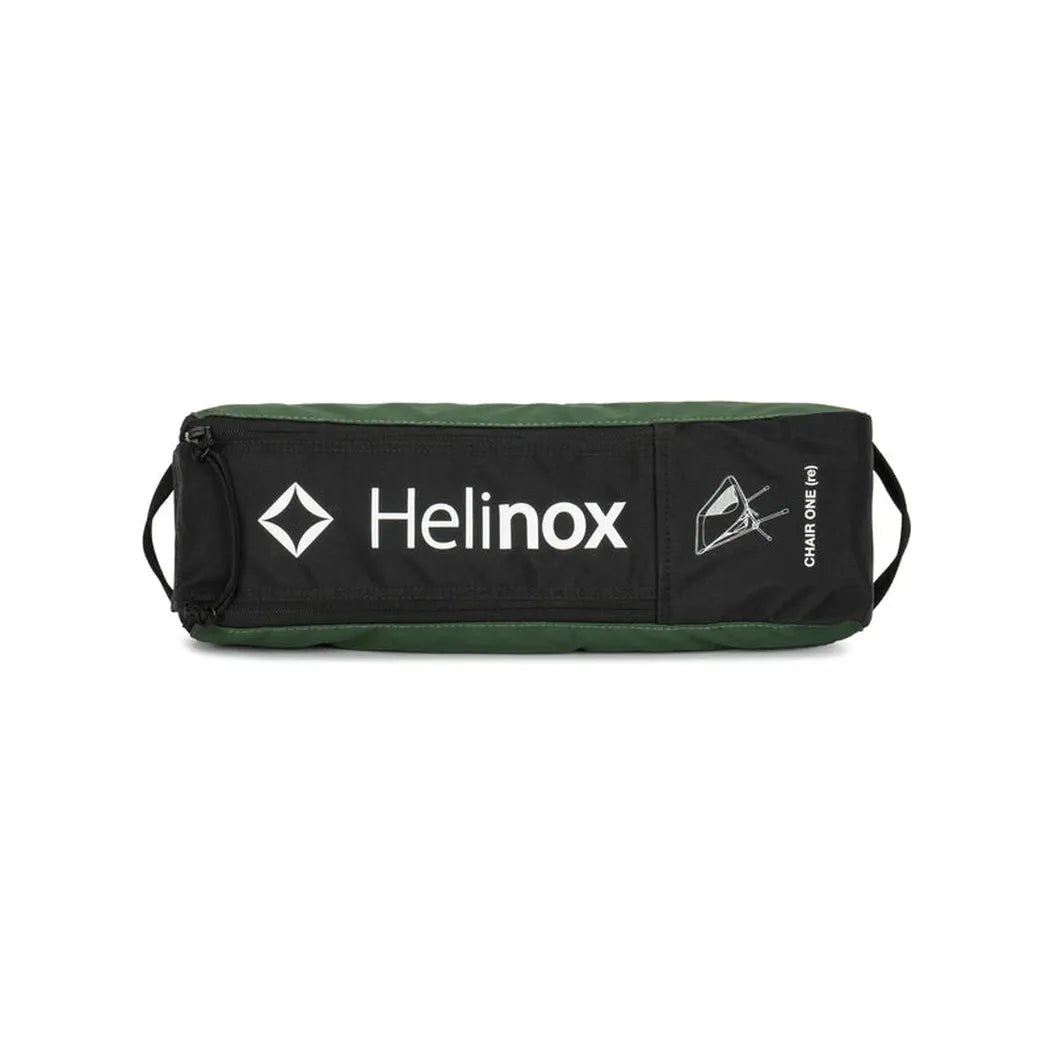 A black Helinox Chair One bag with green trim and white branding, shown from a front angle against a white background.
