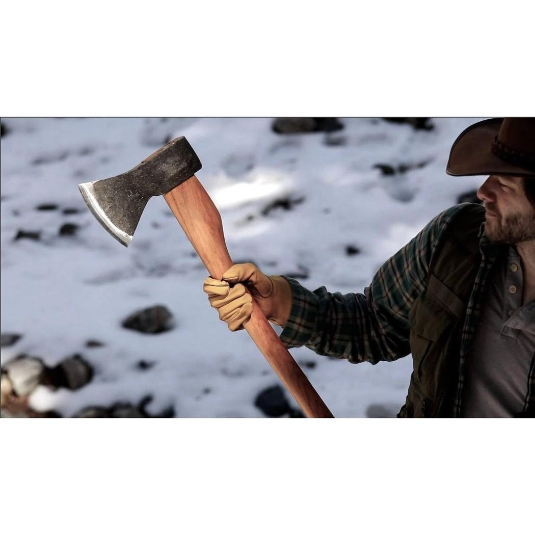A man in a plaid shirt and cowboy hat holds the Helko Werk Bavarian Woodworker axe with a snowy, rocky background.