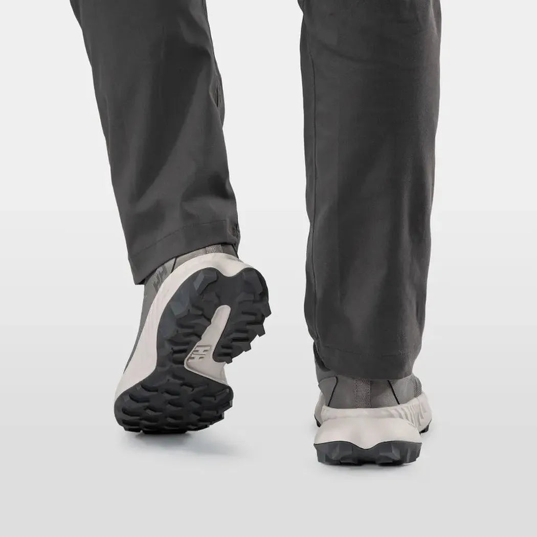 Back view of the Helly Hansen Men’s AWE Hiker DWR Shoes in Concrete/Mellow Grey showing the lugged outsole on a white background.