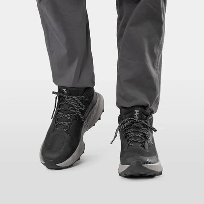 Mid - height Helly Hansen Men's AWE Hiker HELLY TECH Boots in Black/Quiet Shade, shown from the front with a white background.