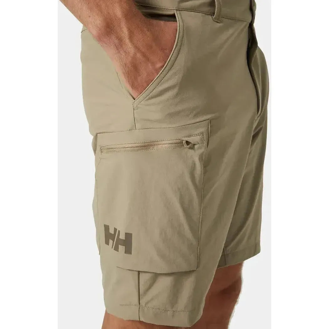 Side view of the Helly Hansen Men's Brono Softshell Shorts in Pebble showing the cargo pocket and model's hand in the front pocket.