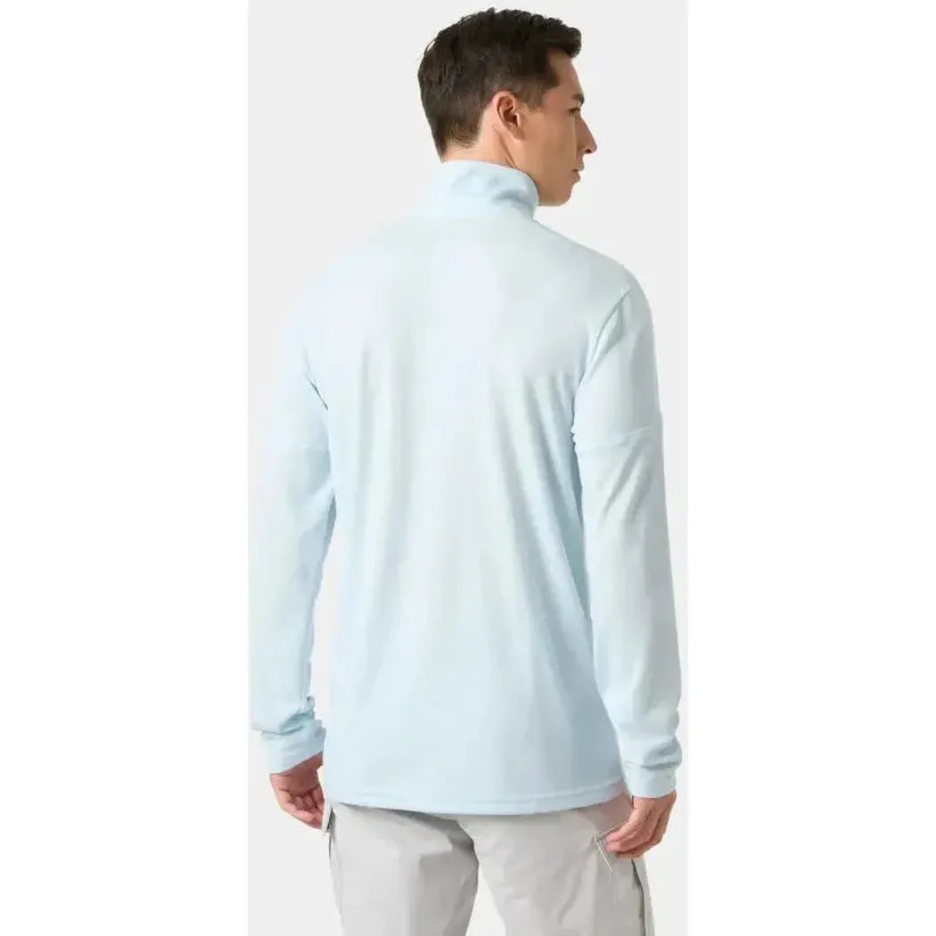Back view of the Helly Hansen Men's HP Half-Zip Pullover 2.0 in Barely Blue on a model wearing light gray pants against a plain white background.