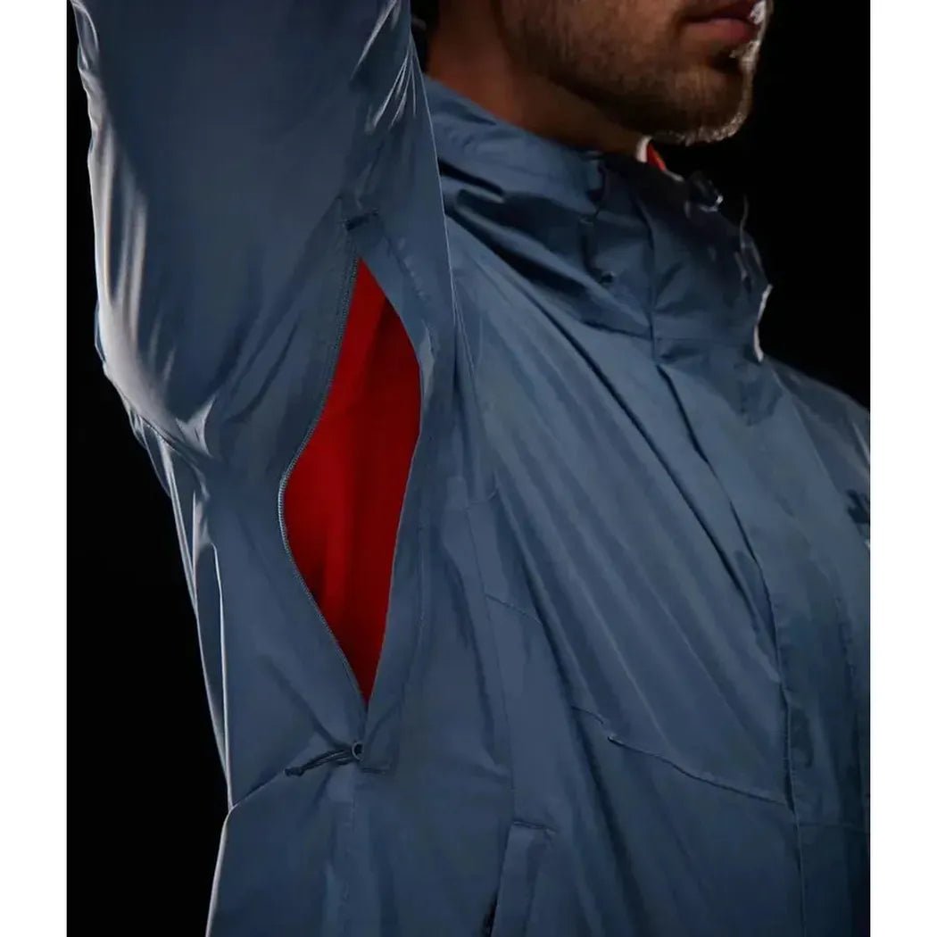 A close-up of the Helly Hansen Men's Loke Jacket 2.0 in Alpine Frost, showing the red inner lining of the sleeve and a dark background.