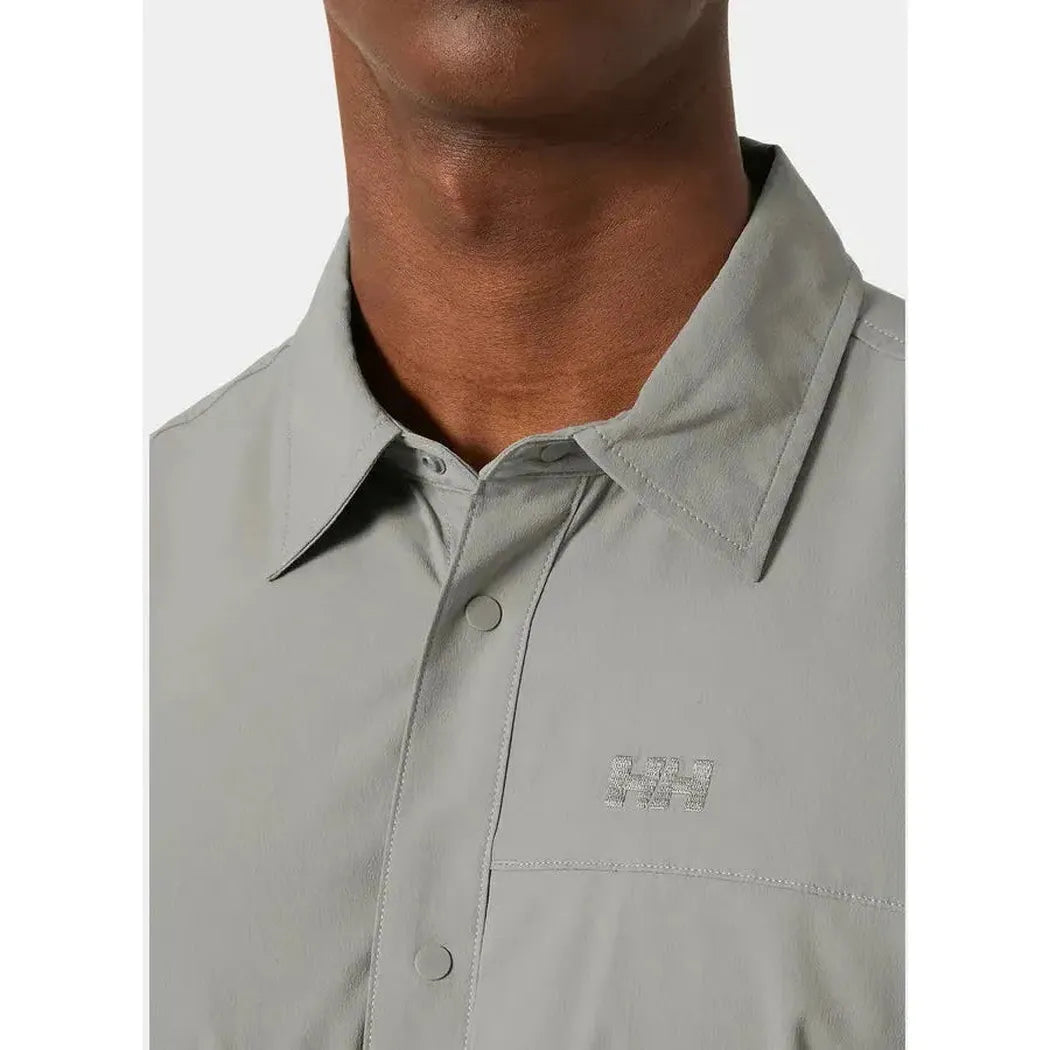A close-up of the Helly Hansen Men's Tofino Sloen Short Sleeve Shirt in Terrazzo, showing the collar and chest pocket against a plain background.
