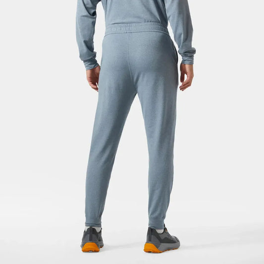 Back view of the Helly Hansen Men's Tyri Knit Joggers in Washed Navy on a model against a white background.