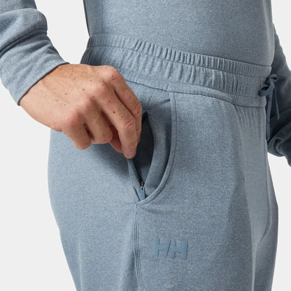 Side view of the Helly Hansen Men's Tyri Knit Joggers in Washed Navy showing the zippered pocket and elastic waistband.