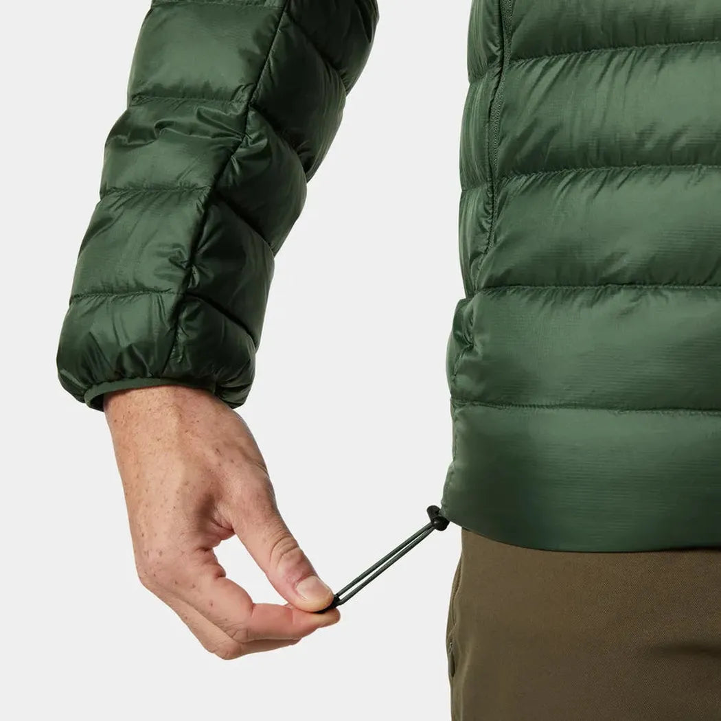 A close-up of the Helly Hansen Men's Verglas Hooded Down Jacket 2.0 in Jungle Green, showing the model holding a drawcord against a plain white background.