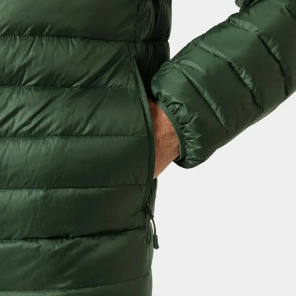 Side view of the Helly Hansen Men's Verglas Hooded Down Jacket 2.0 in Jungle Green showing the hand in the pocket against a white background.