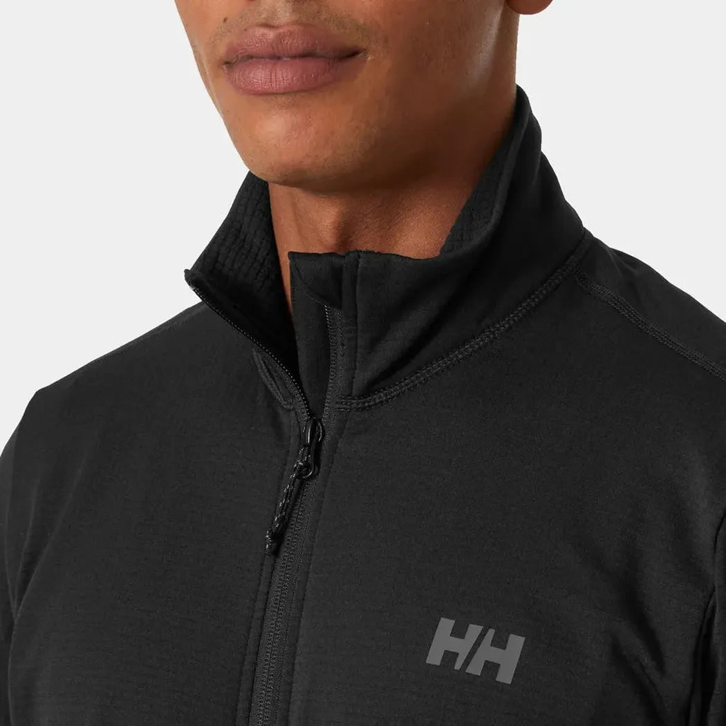 A close-up of the Helly Hansen Men's Versalite Fleece Jacket in Black, showing the high collar and zipper against a plain background.