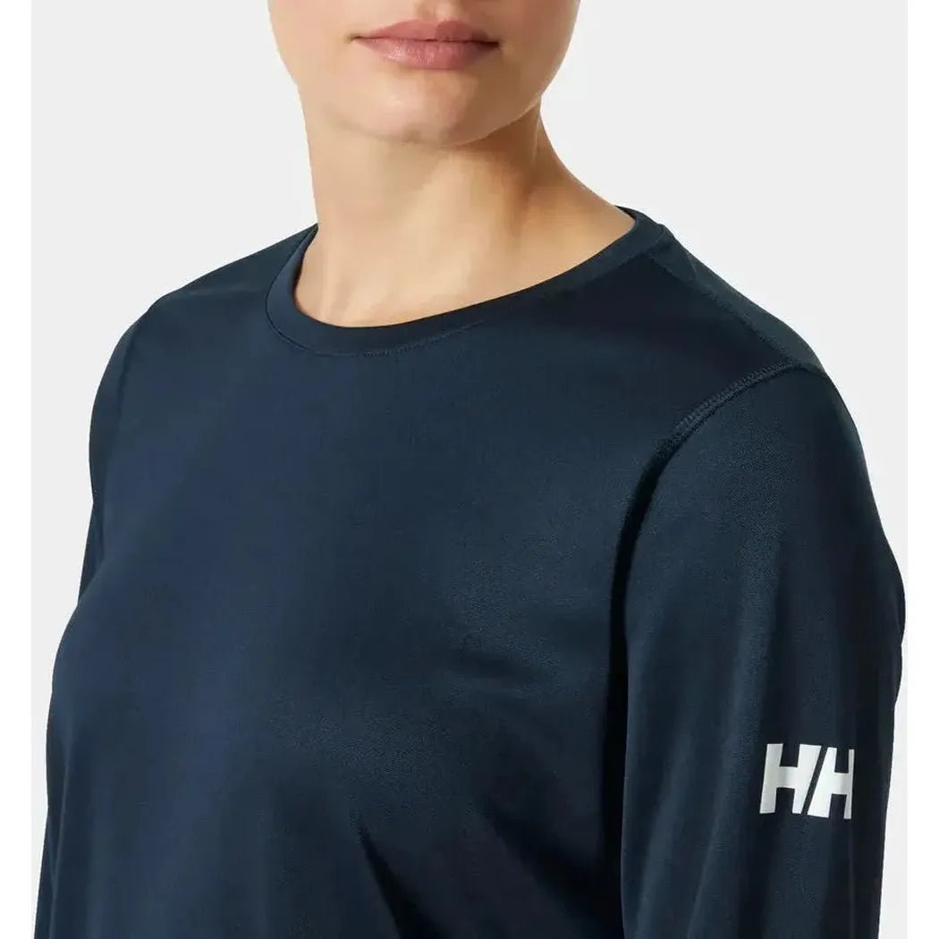 A close-up of the Helly Hansen Women's HH Tech Crew Long Sleeve 2.0 in Navy, showing the logo on the sleeve and a plain white background.