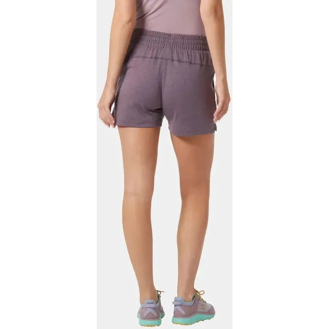 Back view of the Helly Hansen Women's LIFA Tech Lite Shorts in Smoked Purple on a model wearing them against a white background.