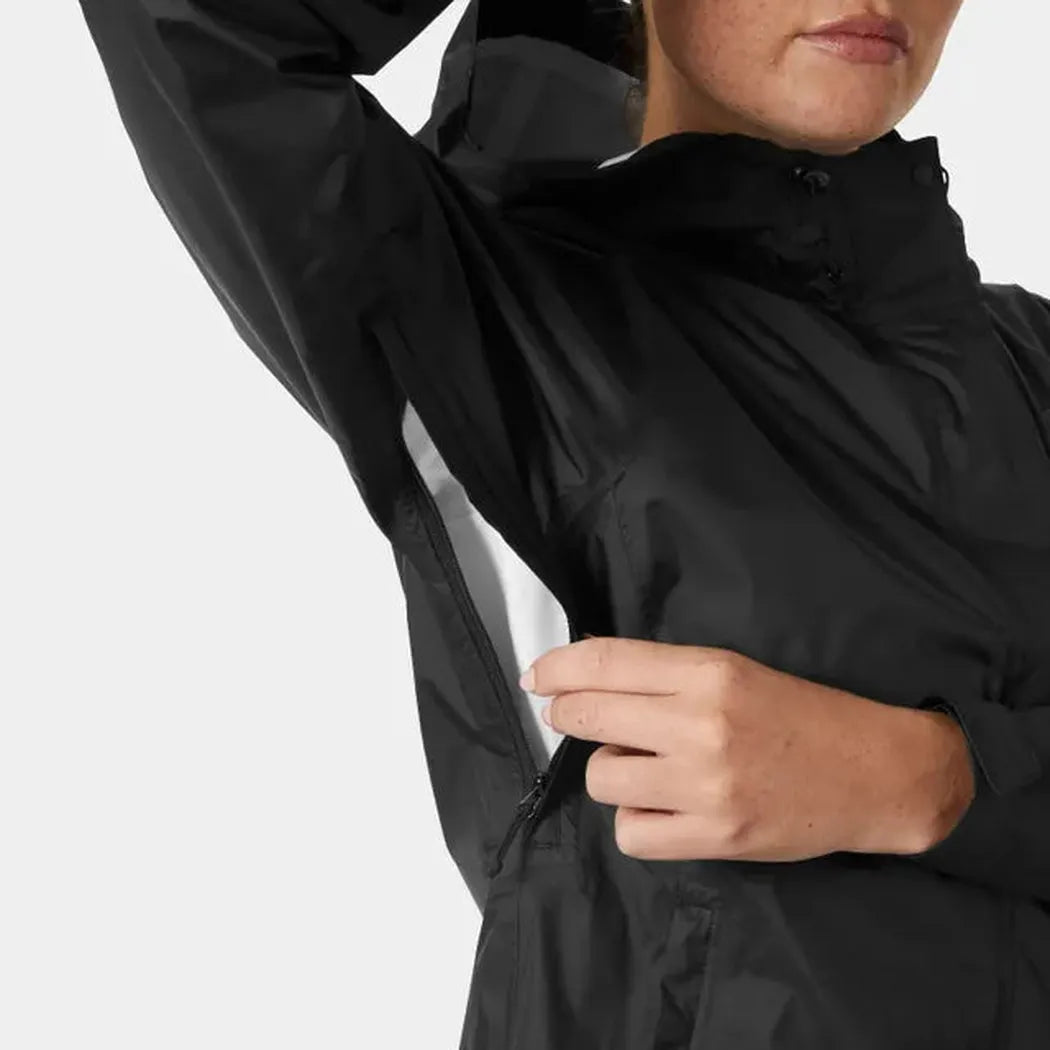 A woman models the black Helly Hansen Women's Loke Jacket 2.0 with a white panel visible on the sleeve, shown from the side against a plain background.