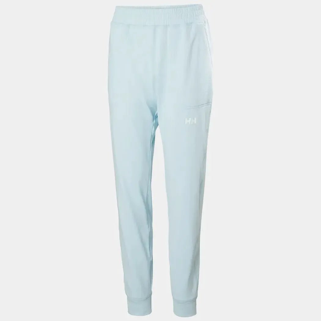 Side view of the Helly Hansen Women's Versalite Fleece Pant in Barely Blue showing the elastic waistband and cuffed ankles against a white background.