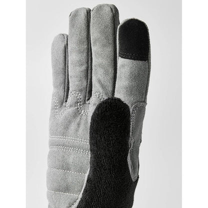 A close-up of the Hestra Job Beta Touch grey work glove showing the textured palm and black touch-sensitive fingertip against a plain background.
