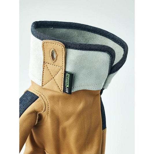A close-up of the Hestra Job Classic Denim glove in Indigo, showing the cuff and stitching against a plain background.
