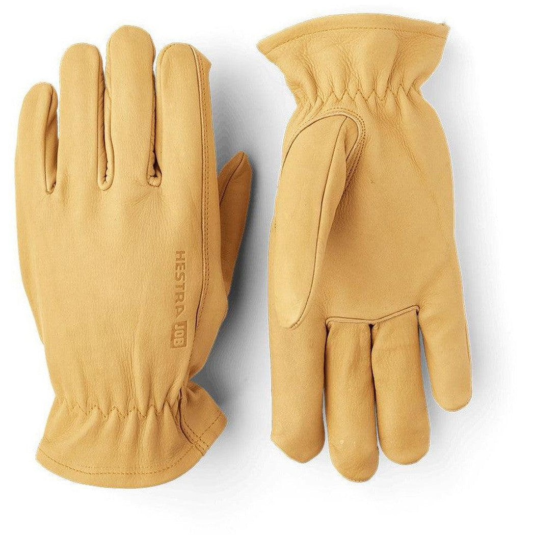 Side view of the Hestra Job Cow Driver Uninsulated gloves in Yellow showing the elastic wrist cuff and stitching details against a white background.