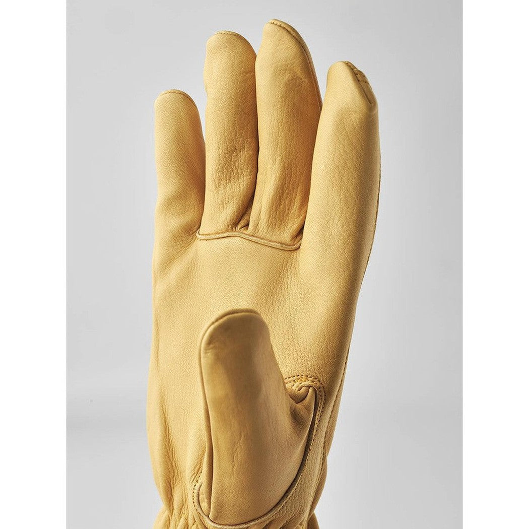 A close-up of the Hestra Job Cow Driver Uninsulated glove in Yellow, showing the palm and a padded thumb section against a plain light background.