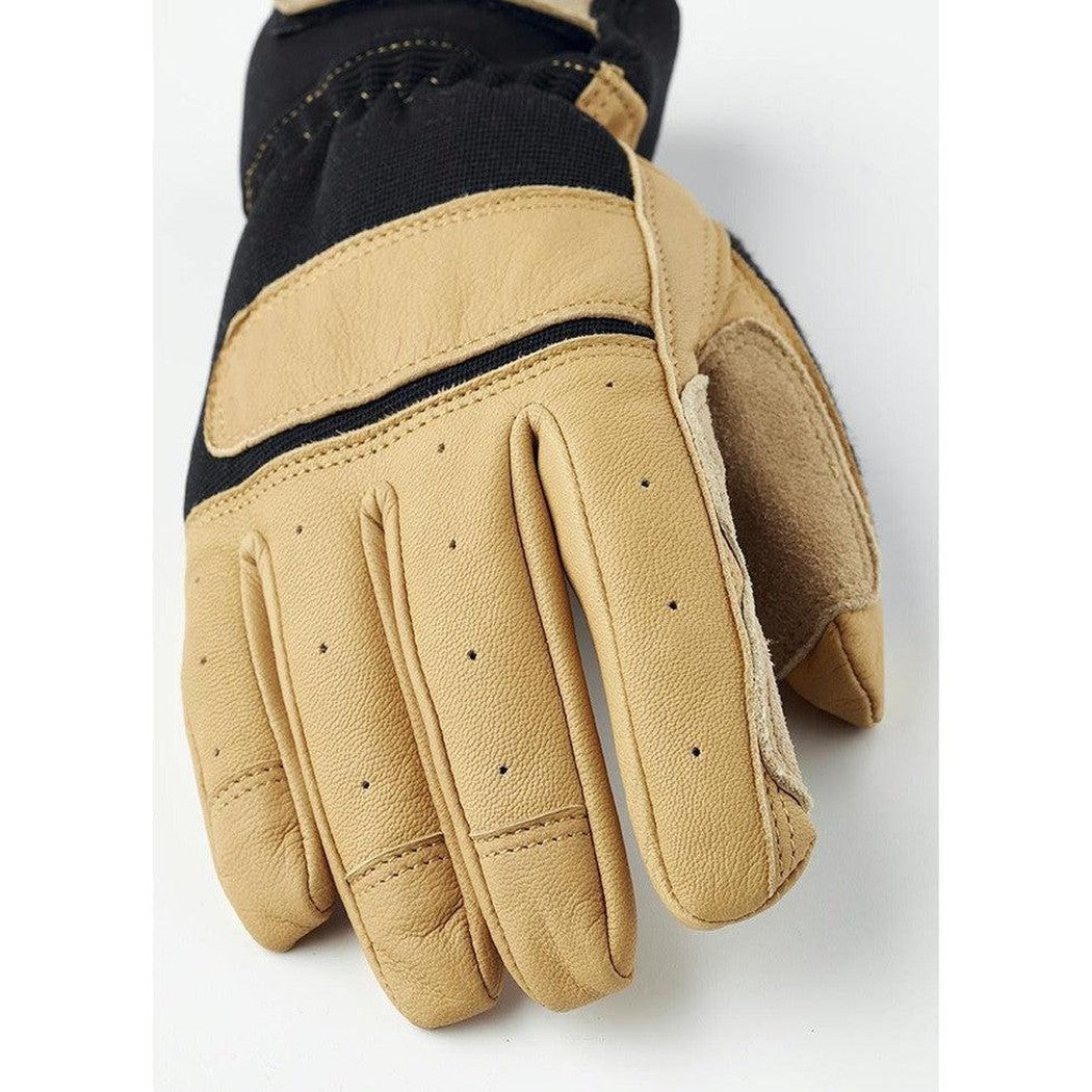 A close-up of the Hestra Job Titan Rope Handler glove in Tan, showing the palm with perforations and a black top section, against a white background.
