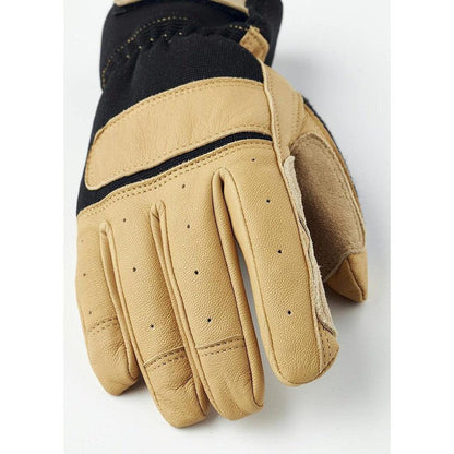 A close-up of the Hestra Job Titan Rope Handler glove in Tan, showing the palm with perforations and a black top section, against a white background.