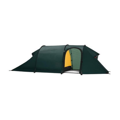 Side view of the Hilleberg Nammatj 2 GT green tent showing the entrance and a white background.