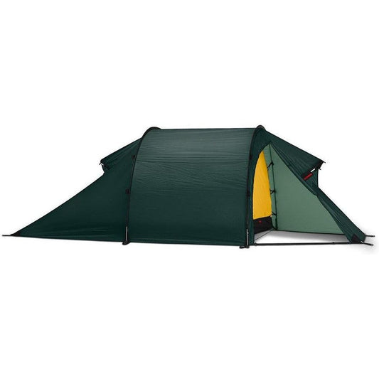 Side view of the Hilleberg Nammatj 3 green tent showing the entrance and a white background.