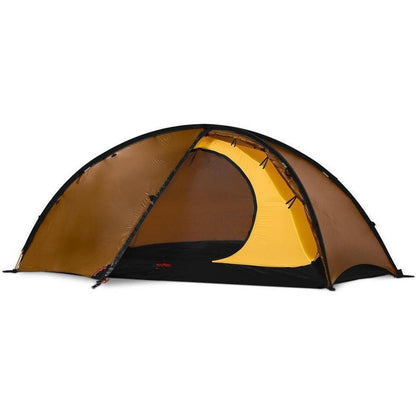 Side view of the Hilleberg Niak tent in Green showing the yellow entrance and black floor against a white background.