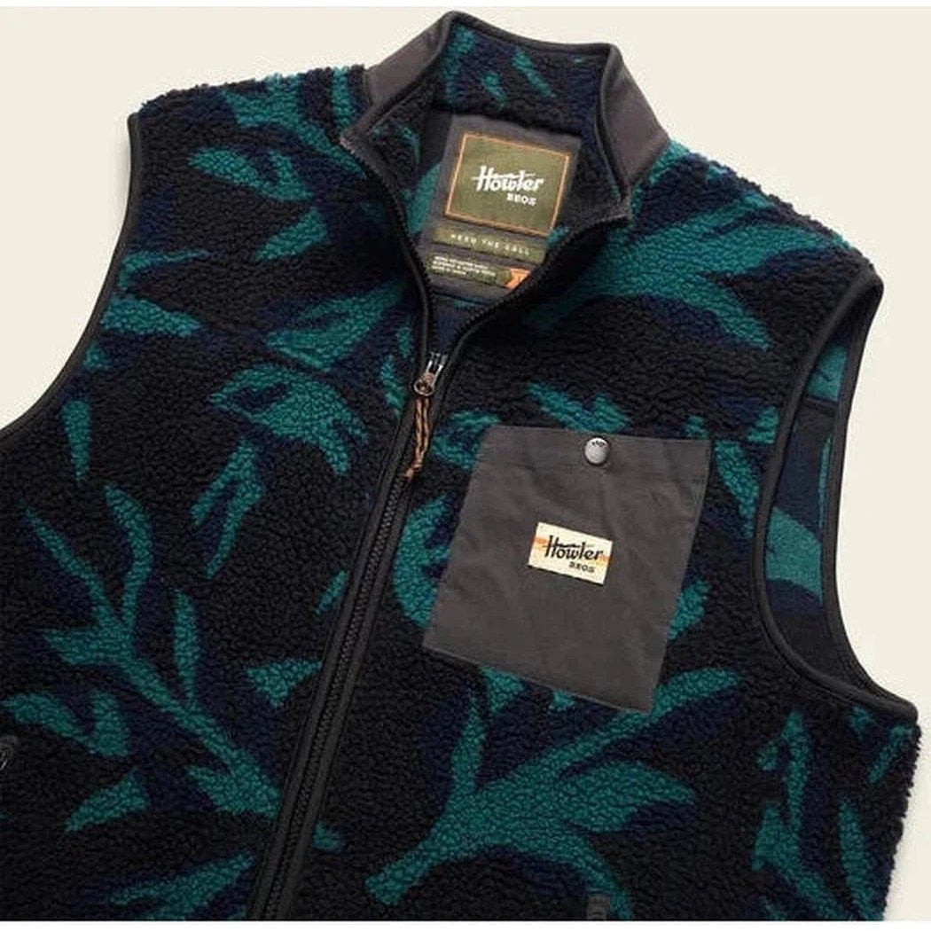 A front view of the Howler Brothers Men's Chisos Fleece Vest in Forgotten Forest : Antique Black showing the front pocket and zipper against a white background.