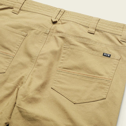 Back view of the Howler Brothers Men's Frontside 5-Pocket Pants in Faded Khaki showing the back pocket and waistband against a white background.