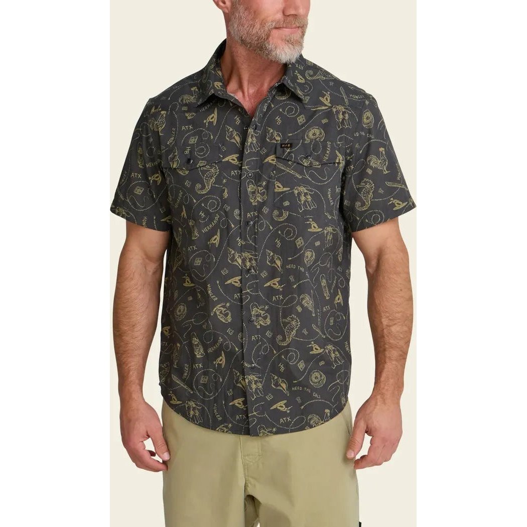 A front view of the Howler Brothers Men's H Bar B Snapshirt in Bouquets: Morel on a model wearing khaki shorts against a neutral background.