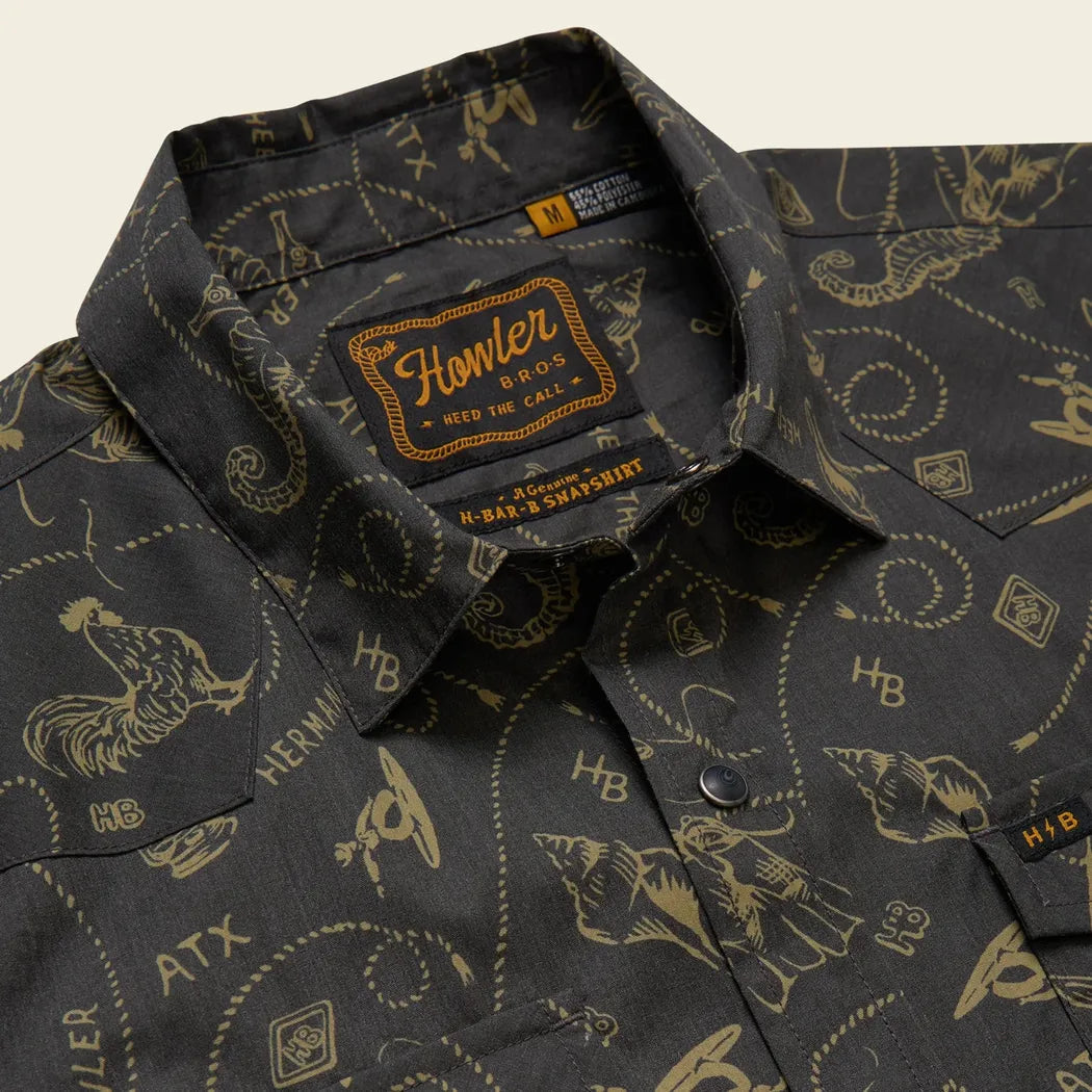 A close-up of the Howler Brothers Men's H Bar B Snapshirt in Bouquets: Morel, showing the collar and patterned fabric.