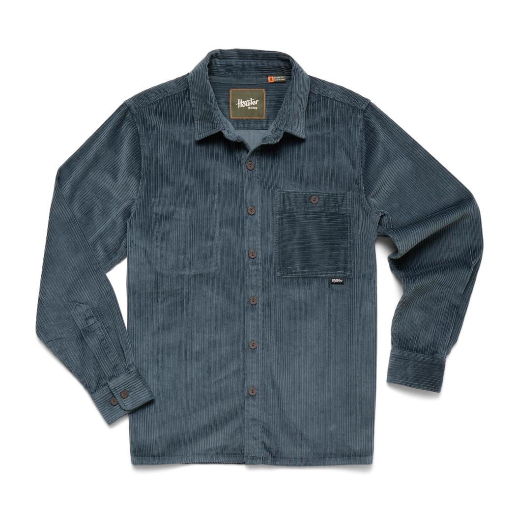 A front view of the Howler Brothers Men's Iquitos Overshirt in Dark Slate with a chest pocket and button front, laid flat against a white background.