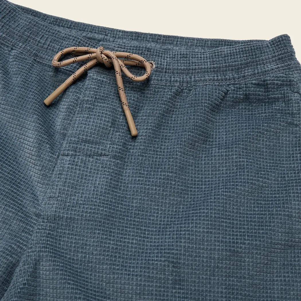 A close-up of the Howler Brothers Men's Pressure Drop Cord Shorts in Grid : Blue Mirage showing the drawstring and textured fabric.