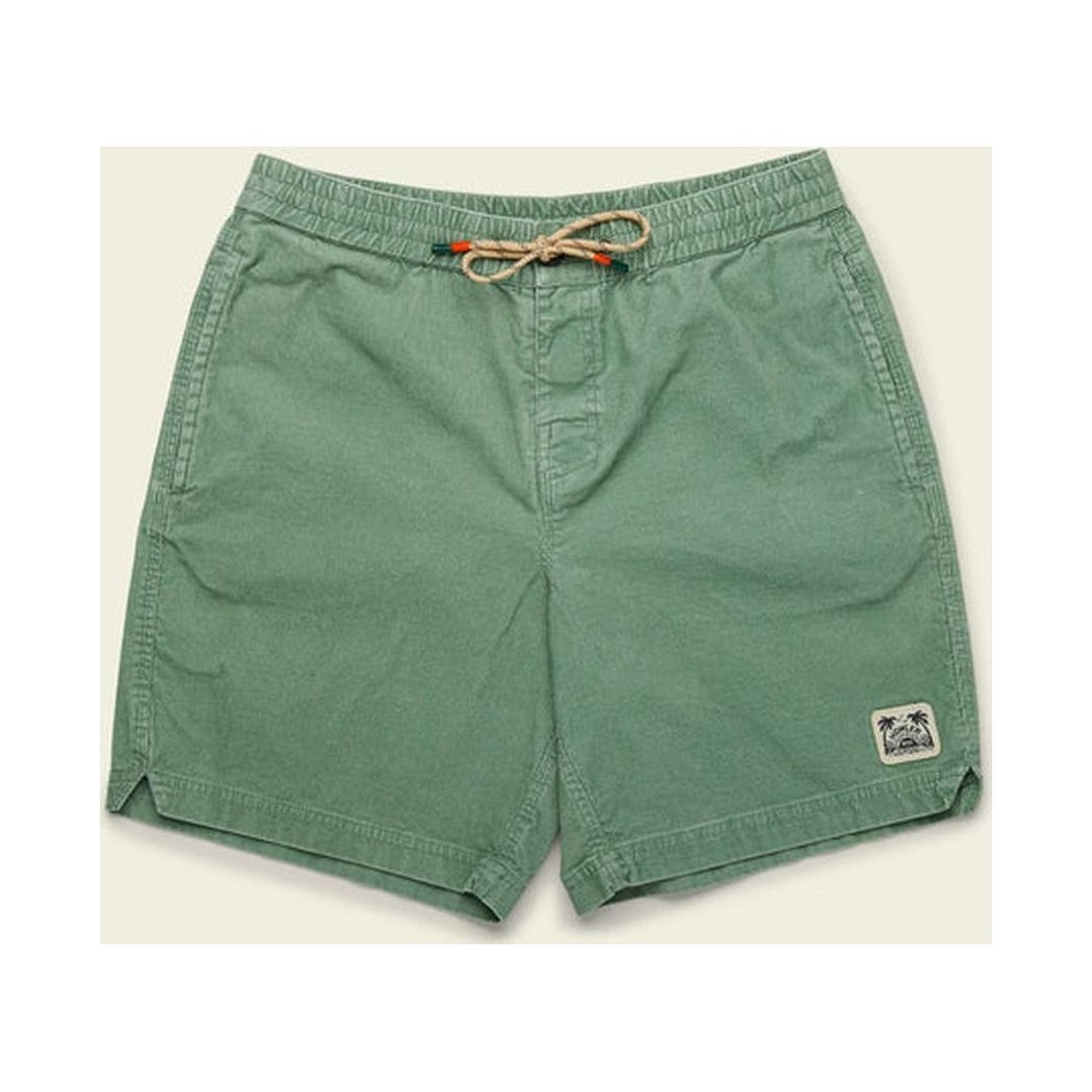 Side view of the Howler Brothers Men's Pressure Drop Cord Shorts in Lichen Green showing the drawstring waist and small logo patch on the right leg against a light background.