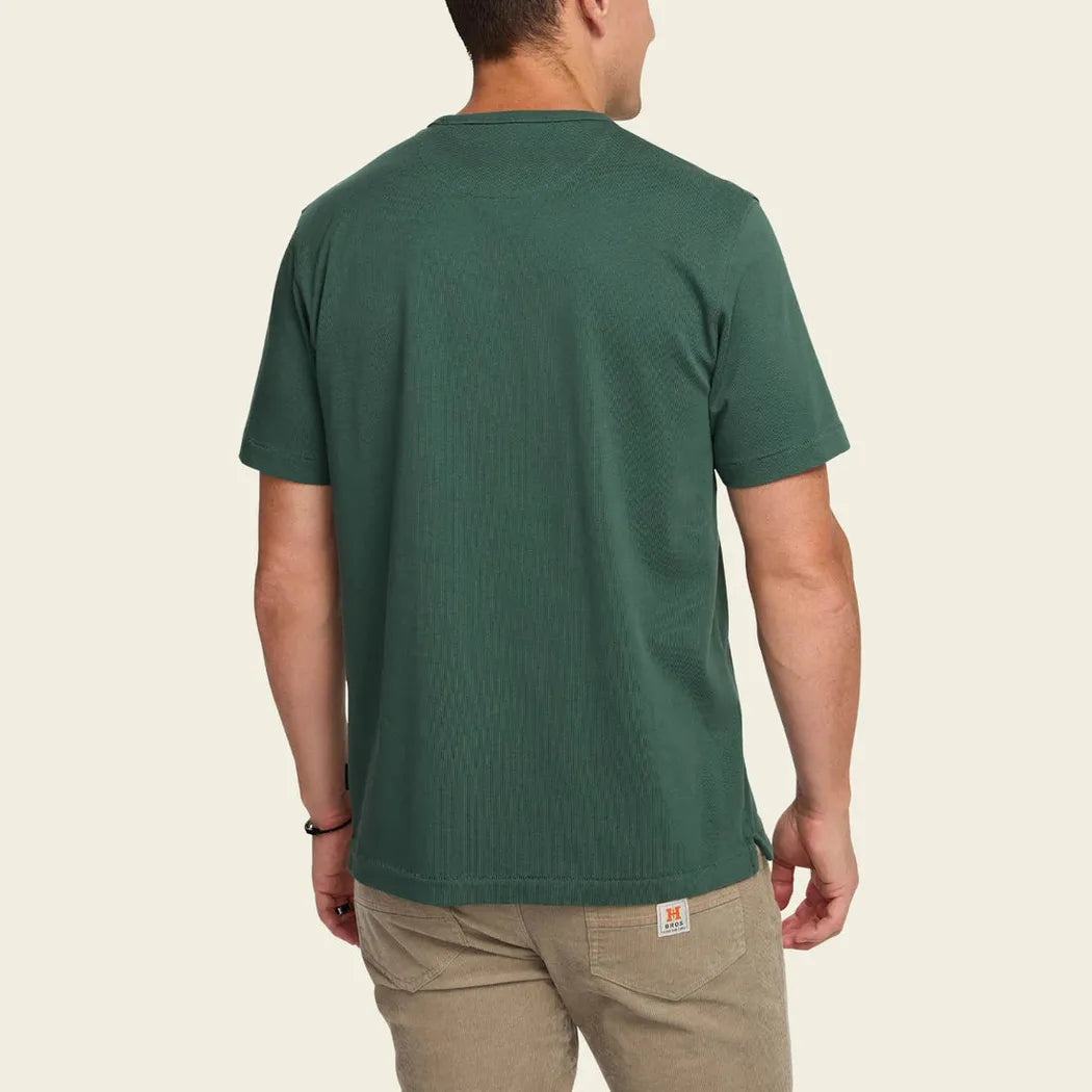 Back view of the Howler Brothers Men's Spectrum Pocket T in Bone White on a model against a plain background.