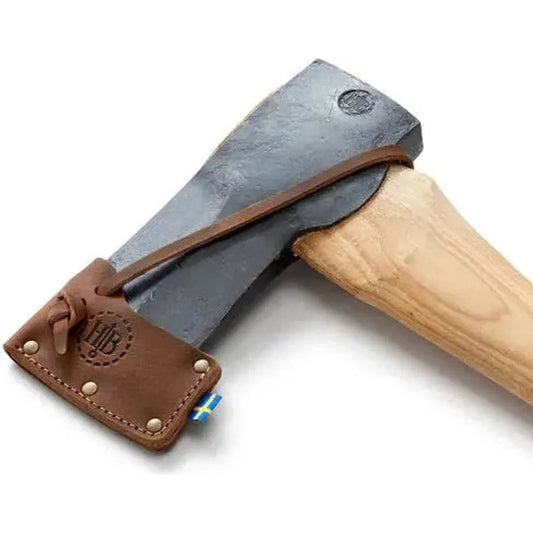 A side view of the Hults Bruk Hult / Kvillinge /Jakobsdal Replacement Sheath with a brown leather strap and a small flag detail against a white background.