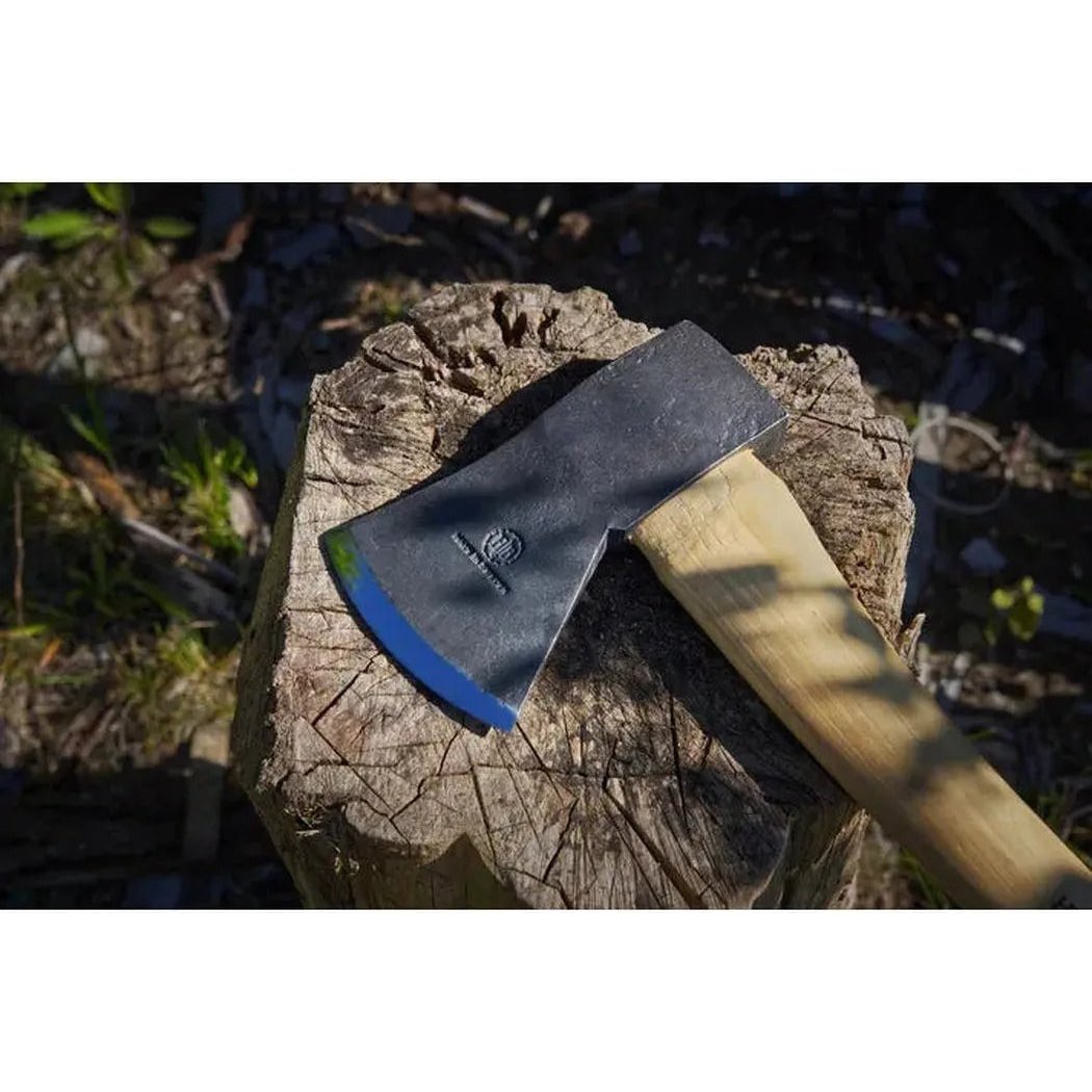A Hults Bruk Jursla Felling Axe rests on a tree stump with a natural outdoor background.
